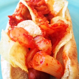 Kimchee Potato Chip Hot Dogs Recipe that is super quick ways to use kimchi. This is spicy, sweet, and comfort food yum. Grab kimchi, chorizo, and a hot dog. Happy Cooking! www.ChopHappy.com 
