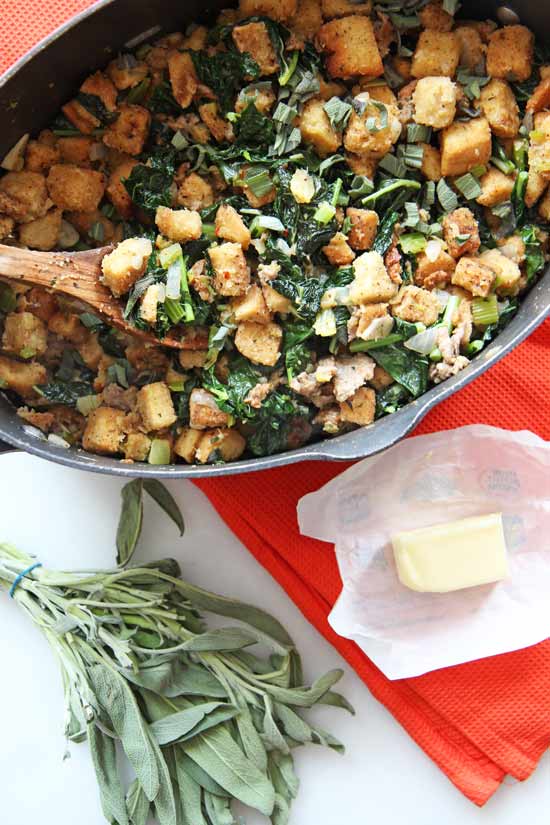 Easy Crouton Kale and Sausage Stuffing Recipe. This is a fast #Thanksgiving recipe or perfect #sundaydinner #sidedish. The garlicky break, sweet sausage, and deep green kale makes this perfect #recipe. www.ChopHappy.com