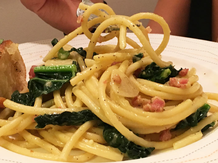Kale and Bacon Carbonara Pasta Recipe - that is comfort food chessy quick dinner that is so easy to make. Grab eggs, cheese, bacon, and pasta. Happy Cooking. www.ChopHappy.com #comfortfood #pasta #quickdinner