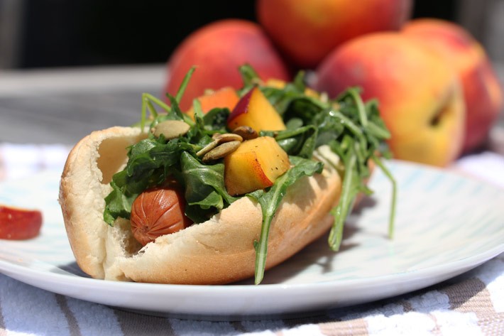 Summer Salad Hot Dog Recipe- that has a lemony sweet peach and peppery arugula salad on top! #comfortfood love! Happy Cooking! www.ChopHappy.com