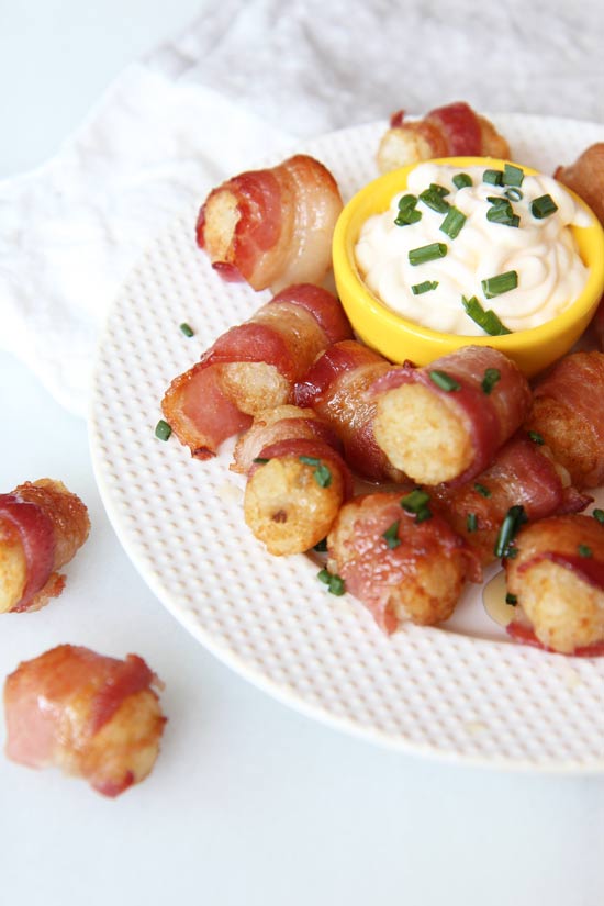 Honey Glazed Bacon Wrapped Tater Tots Recipe - is so comfort food decadent! This is so easy and it is baked. It is oven baked, we use frozen tater tots, and wrap it all in a yummy piece of #bacon. Hope you enjoy this quick #appetizer. www.ChopHappy.com