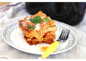 Slow Cooker Lasagna that is super simple, takes 3 minutes to assemble, and you don't even need to boil noodles. Home Cook Victory! ChopHappy.com
