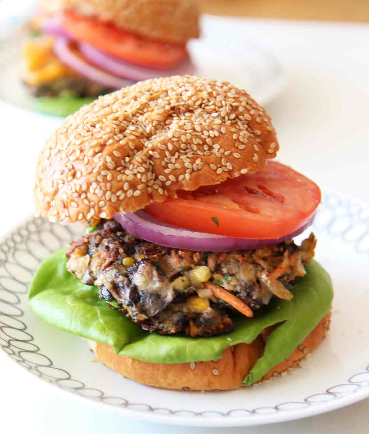 Veggie Burger Recipe. This will convert any meat eater to the veggie side. The beefy portobello, creamy crushed chick peas, and the zesty spices makes a perfect easy burger. Best part it takes 10 minutes to make. ChopHappy.com.