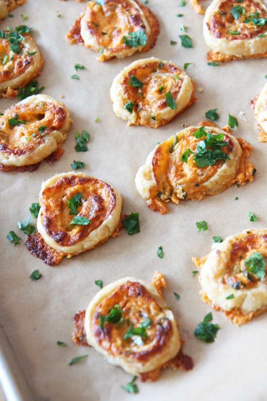 Jalapeno Popper Pinwheel (Happy Make Ahead Fun) Recipe - that is a perfect party appetizer. There is sharp cheese, spicy jalapeño, and creamy cream cheese to form a comfort food happy bite. Happy Cooking. www.ChopHappy.com