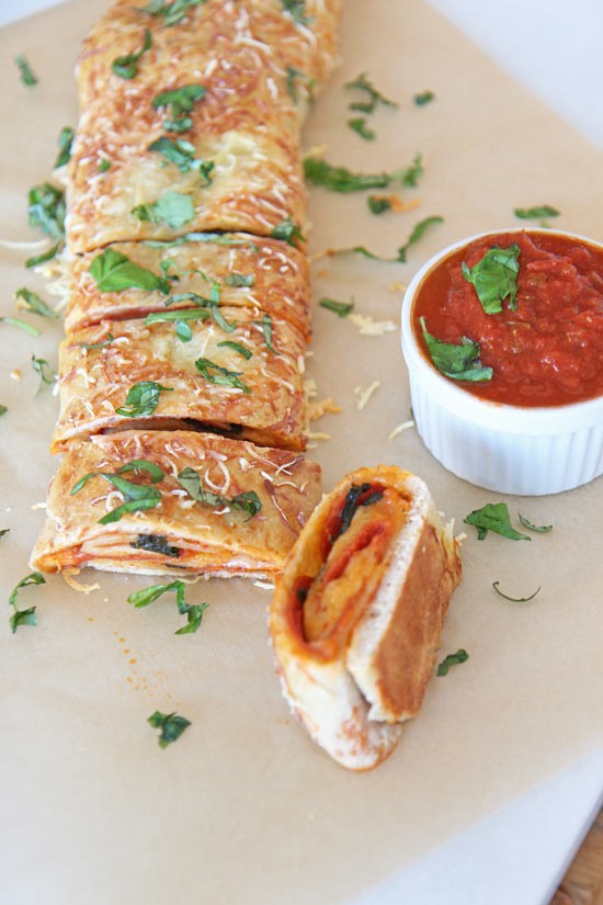 Pepperoni Pizza Stromboli Recipe. This is an easy quick dinner recipe that is a pizza all rolled up. Happy Cooking! www.ChopHappy.com #pizza #simplerecipe