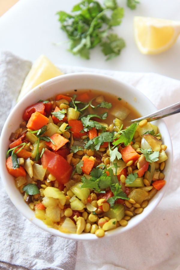 Slow Cooker Turmeric Lentil Soup Recipe. This is the prefect busy weeknight dinner. The lentils, ginger, turmeric, cumin, and veggies dance together to make lots of soup. #soup #slowcookerrecipe