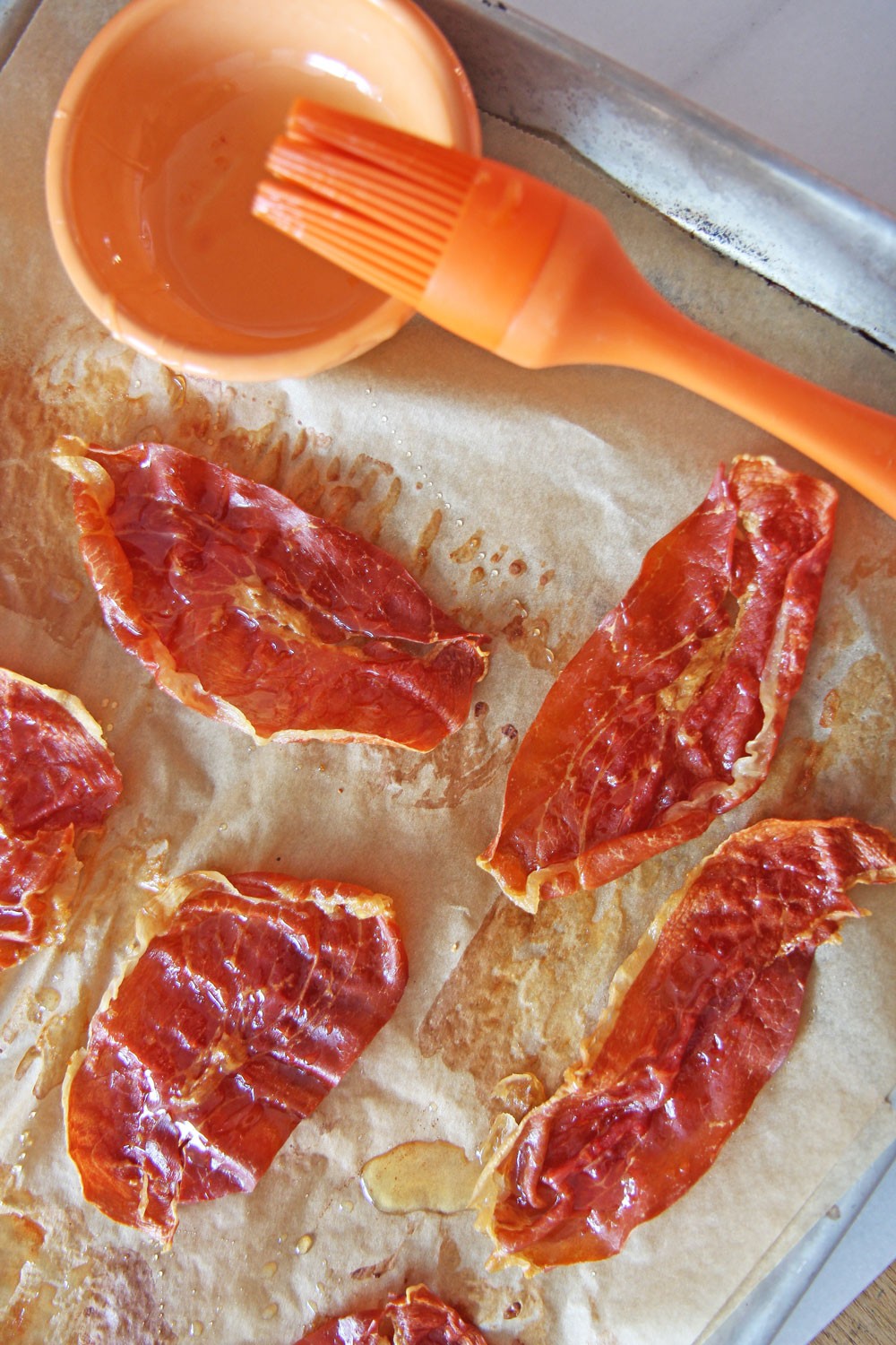 Sheet Pan Crispy Honey Prosciutto Recipe. This is a simple sheet pan recipe. The ingredients are just prosciutto and honey. The key is to cook in a hot oven and enjoy. Perfect brunch recipe, with eggs, or as a BLT. Happy Cooking! #sheetpanrecipe #proscuitto