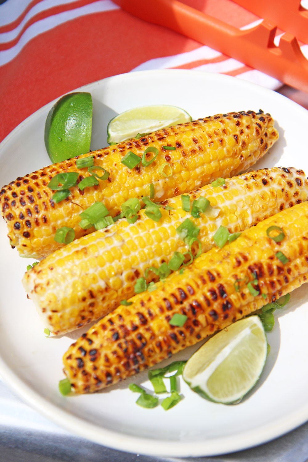 Grilled Cambodian Street Corn Recipe. This is super easy 15 minute grilling side. You make a simple sauce from coconut milk, fish sauce, scallions and sugar. Then you grill and dip till chared on the outside and sweet and juicy on the inside. Happy corn making! www.ChopHappy.com #cornrecipe #grilledcorn