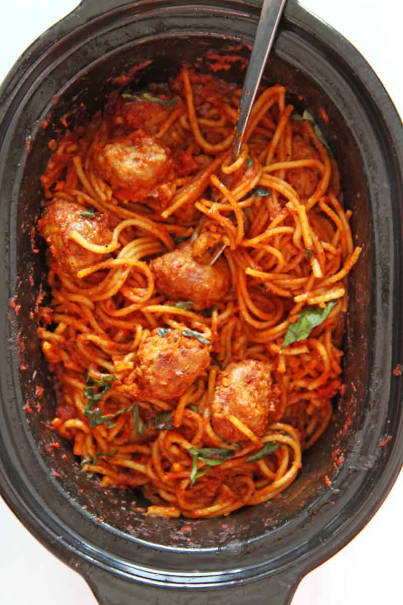 Slow Cooker Spaghetti and Meatballs (3 Ingredient Recipe). This is a super easy weeknight pasta dinner. You need spaghetti, marinara sauce, water, and sausage. Happy Cooking! www.chophappy.com #spaghettiandmeatballs #slowcookerrecipes