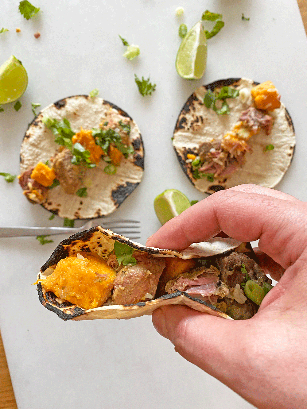 3 Ingredient Slow Cooker Pork and Sweet Potato Taco Recipe.This is a five ingredient dinner recipe that is ready when you get home from work. You can make this into tacos, burrito bowls, or soup if you add chicken broth. Happy Cooking! www.ChopHappy.com #slowcookertaco #porktaco