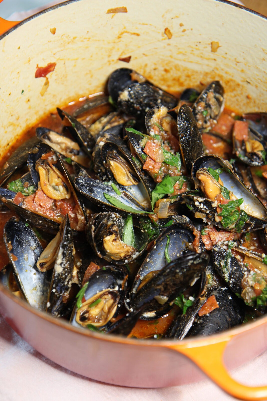 How To Make Pepperoni Pizza Mussels. This is a 15 minutes pizza seafood recipe that is so saucy yum. Grab pepperoni and shallots and sizzle in the pan with mussels, Parm and Italian herbs. Happy Cooking! www.ChopHappy.com #mussels #howtomakeMussles