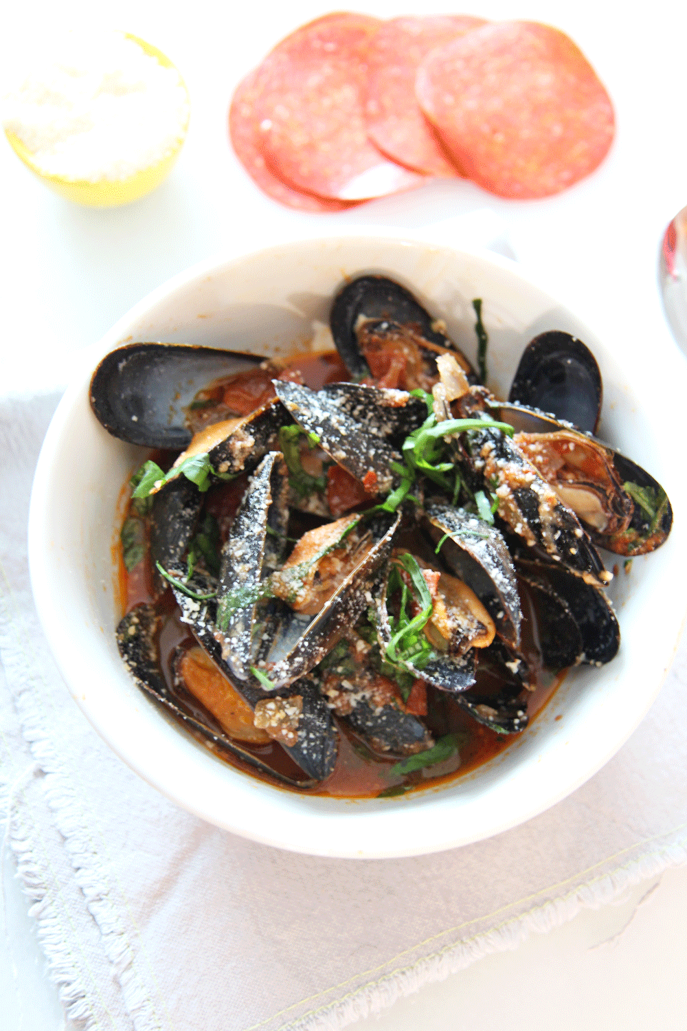 How To Make Pepperoni Pizza Mussels. This is a 15 minutes pizza seafood recipe that is so saucy yum. Grab pepperoni and shallots and sizzle in the pan with mussels, Parm and Italian herbs. Happy Cooking! www.ChopHappy.com #mussels #howtomakeMussles