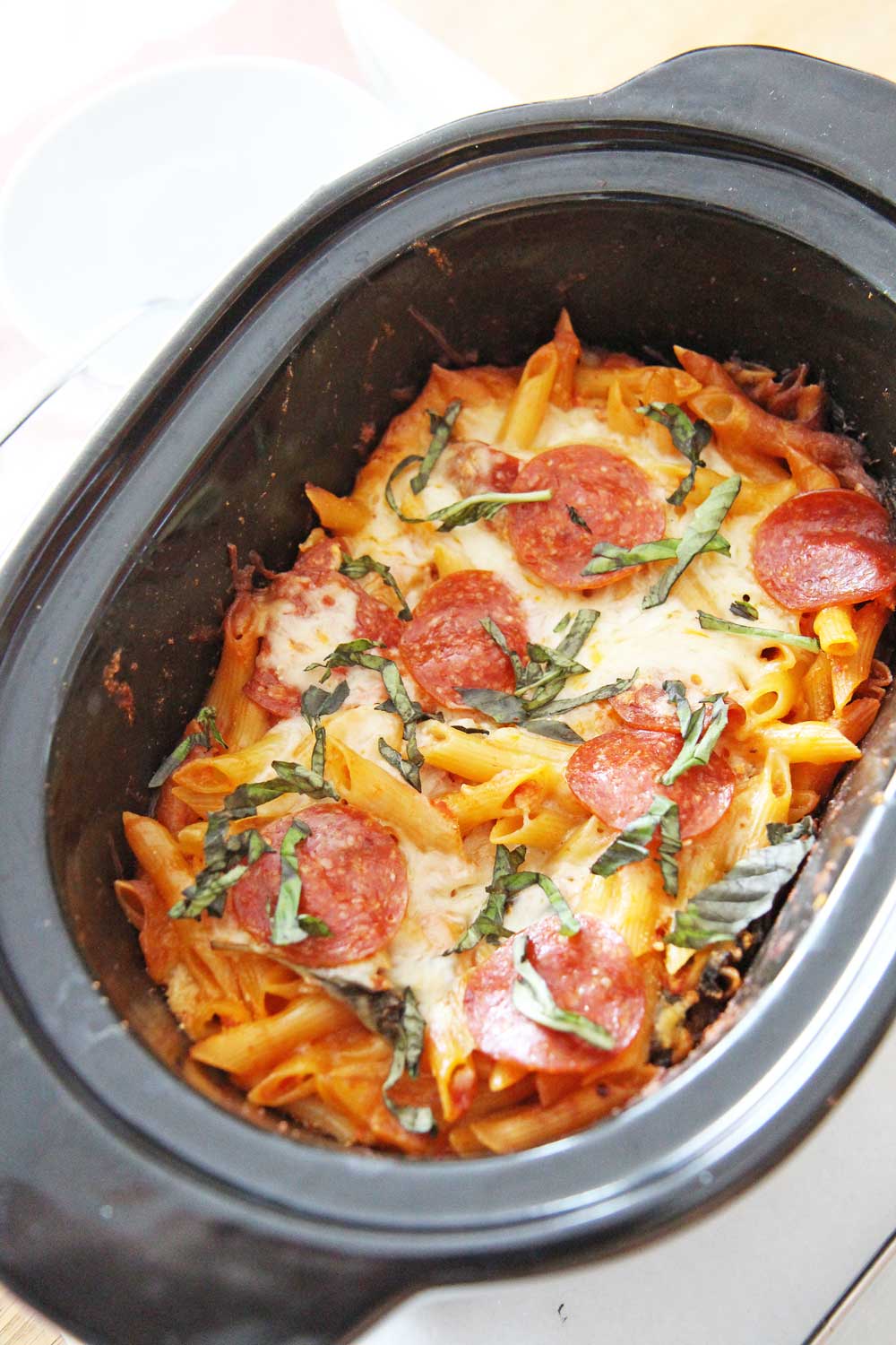 How to Make Baked Ziti in a Slow Cooker. All you need is pasta, ricotta cheese, marinara sauce, mozzarella, and pepperoni. This is an easy recipes for busy moms and families. Happy Cooking! www.ChopHappy.com #bakedziti #slowcookerpasta