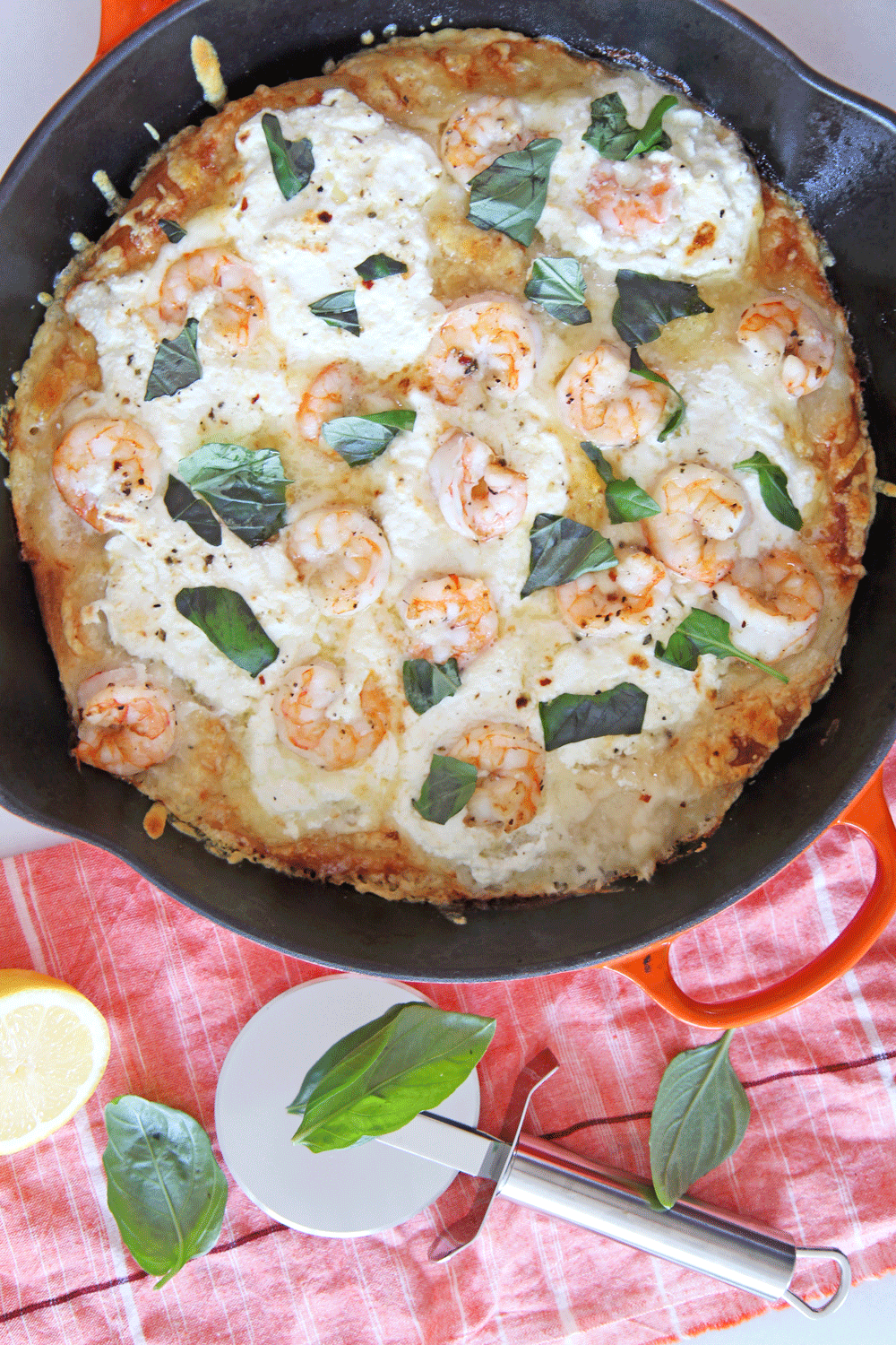 Shrimp Scampi Pizza in a Cast Iron Pan. This is the perfect one pan dinner that is done in 10 minutes. You cook the pizza in a cast iron pan for crispy cheesy crust. Happy Pizza Making! www.ChopHappy.com #Howtomakehomemadepizza #shrimpscampi