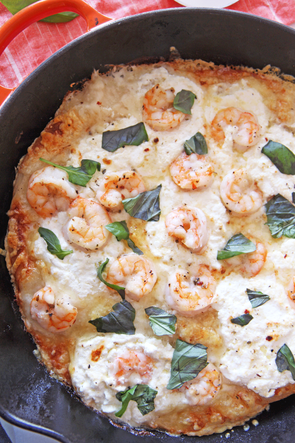Shrimp Scampi Pizza in a Cast Iron Pan. This is the perfect one pan dinner that is done in 10 minutes. You cook the pizza in a cast iron pan for crispy cheesy crust. Happy Pizza Making! www.ChopHappy.com #Howtomakehomemadepizza #shrimpscampi