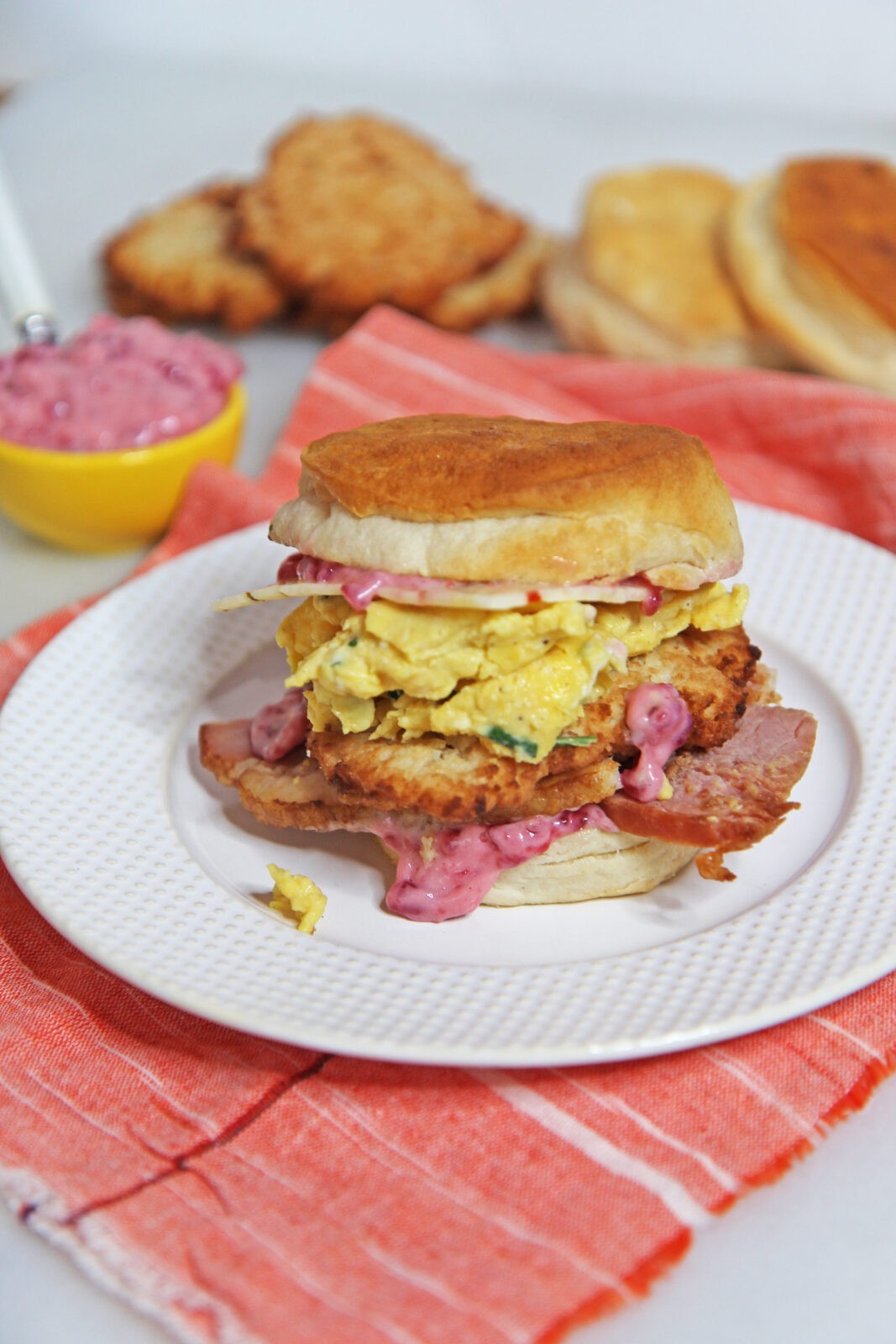 Leftover Ham Egg and Potato Pancake Biscuit Sandwich Recipe. After Christmas, Thanksgiving, or Sunday dinner grab you leftovers for the perfect breakfast sandwich. Ham, egg, mashed potatoes, cranberry sauce all make the ultimate brunch biscuit! Happy Cooking! www.ChopHappy.com #leftovers #ham