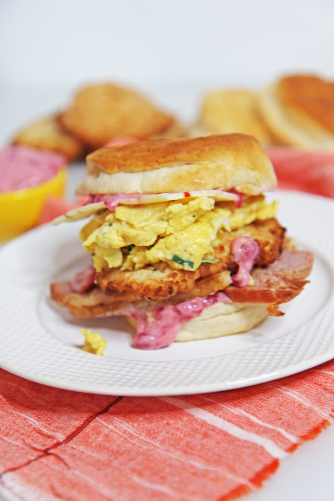 Leftover Ham Egg and Potato Pancake Biscuit Sandwich Recipe. After Christmas, Thanksgiving, or Sunday dinner grab you leftovers for the perfect breakfast sandwich. Ham, egg, mashed potatoes, cranberry sauce all make the ultimate brunch biscuit! Happy Cooking! www.ChopHappy.com #leftovers #ham