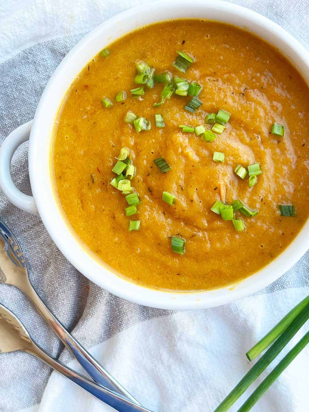 Roasted Carrot Soup Recipe. This is a an easy sheet pan recipe that takes leftover veggies and makes it into soup. Fast recipe with little clean up. Happy Cooking! www.ChopHappy.com #carrotrecipes #carrotsoup